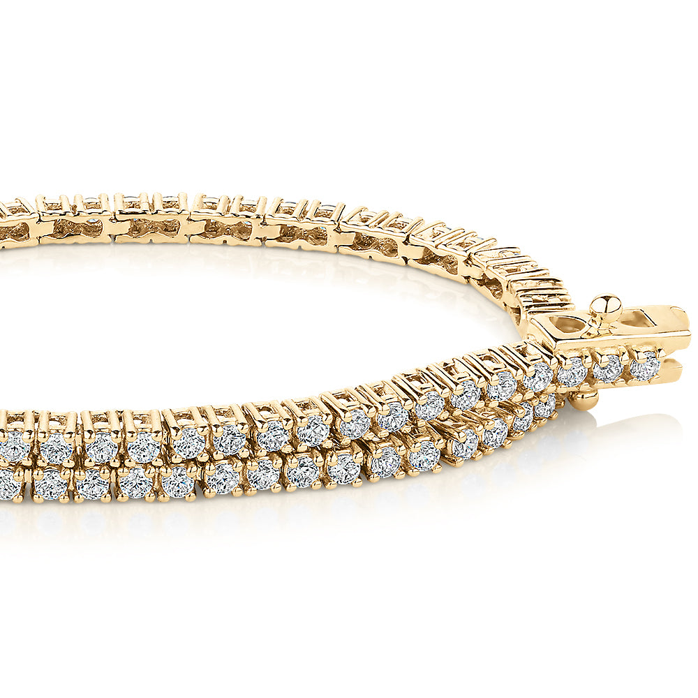 Round Brilliant tennis bracelet with 1.29 carats* of diamond simulants in 10 carat yellow gold