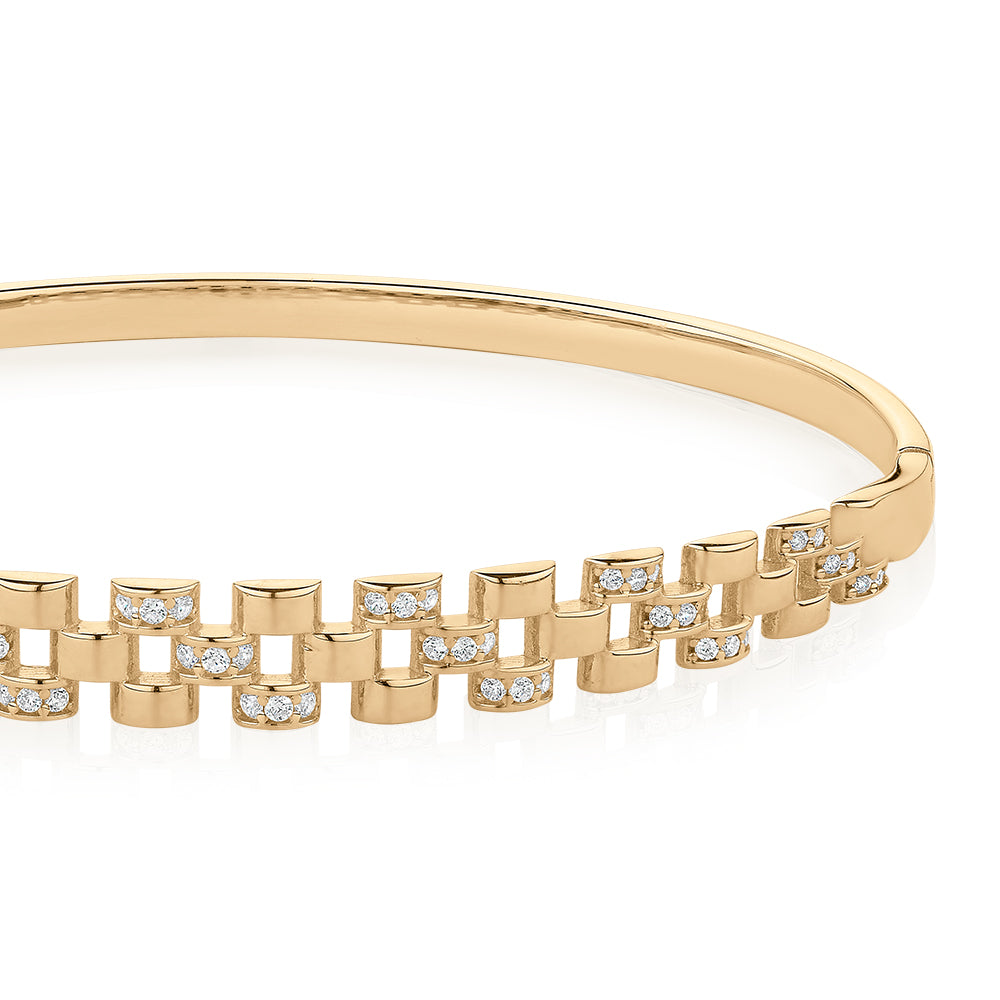 Round Brilliant bangle with diamond simulants in 10 carat yellow gold