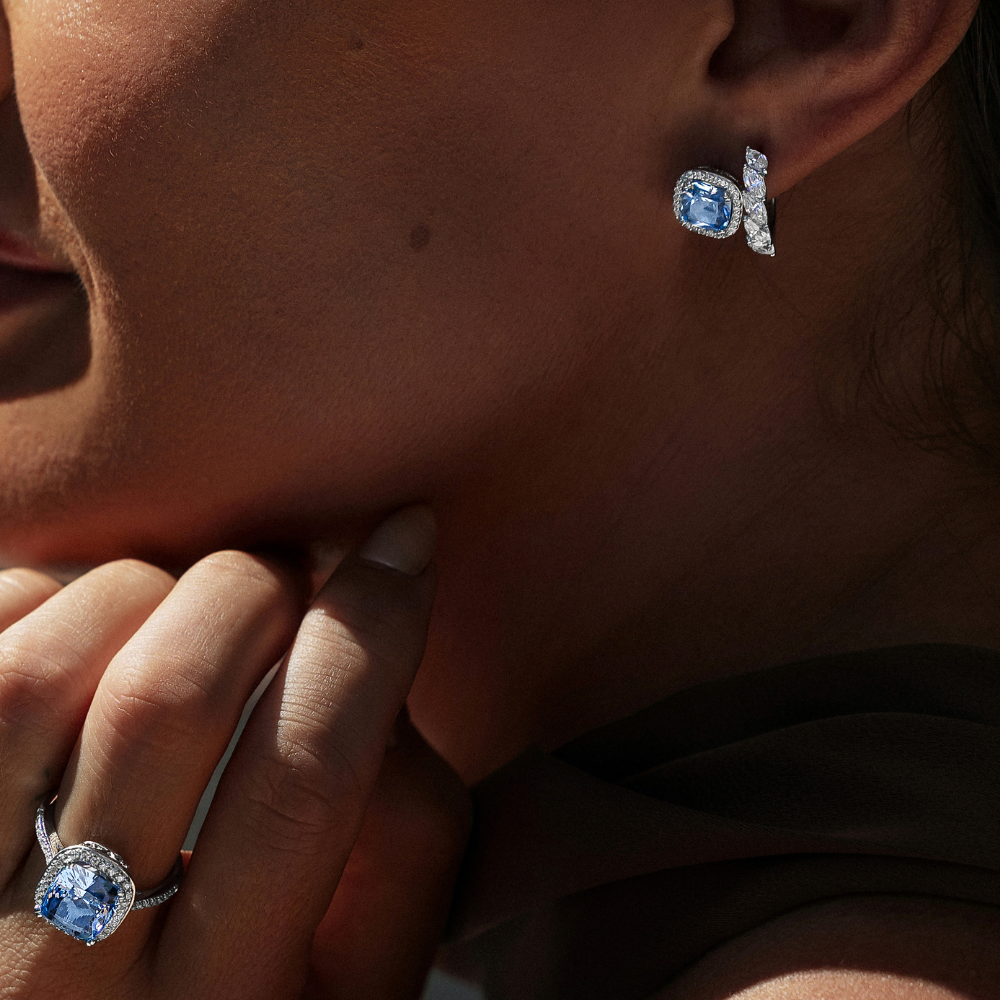 Cushion and Round Brilliant halo stud earrings with blue topaz simulants and 2.81 carats* of diamond simulants in sterling silver