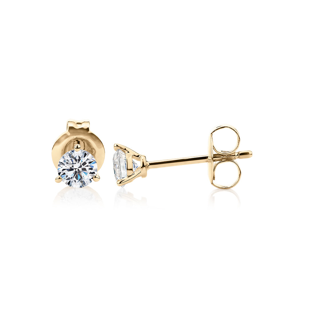 Round Brilliant stud earrings with 0.5 carats* of diamond simulants in 10 carat yellow gold