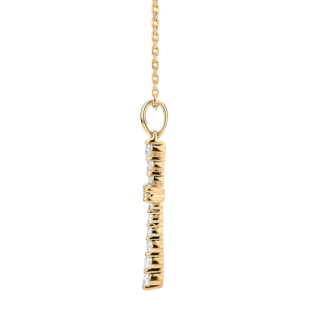 Cross pendant with 0.25 carats* of diamond simulants in 10 carat yellow gold