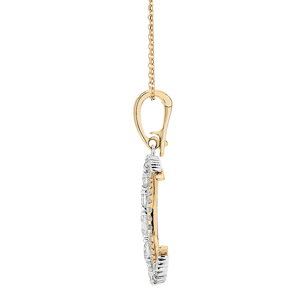 Fancy pendant with 1.12 carats* of diamond simulants in 10 carat yellow gold and sterling silver