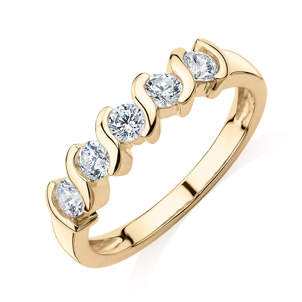 Wedding or eternity band with 0.55 carats* of diamond simulants in 10 carat yellow gold