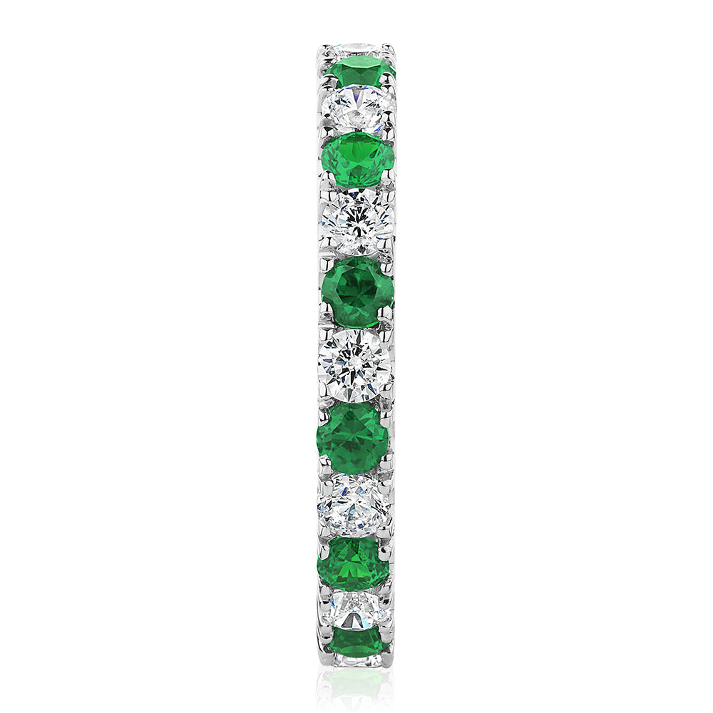 All-rounder eternity band with emerald simulants and 0.78 carats* of diamond simulants in 14 carat white gold