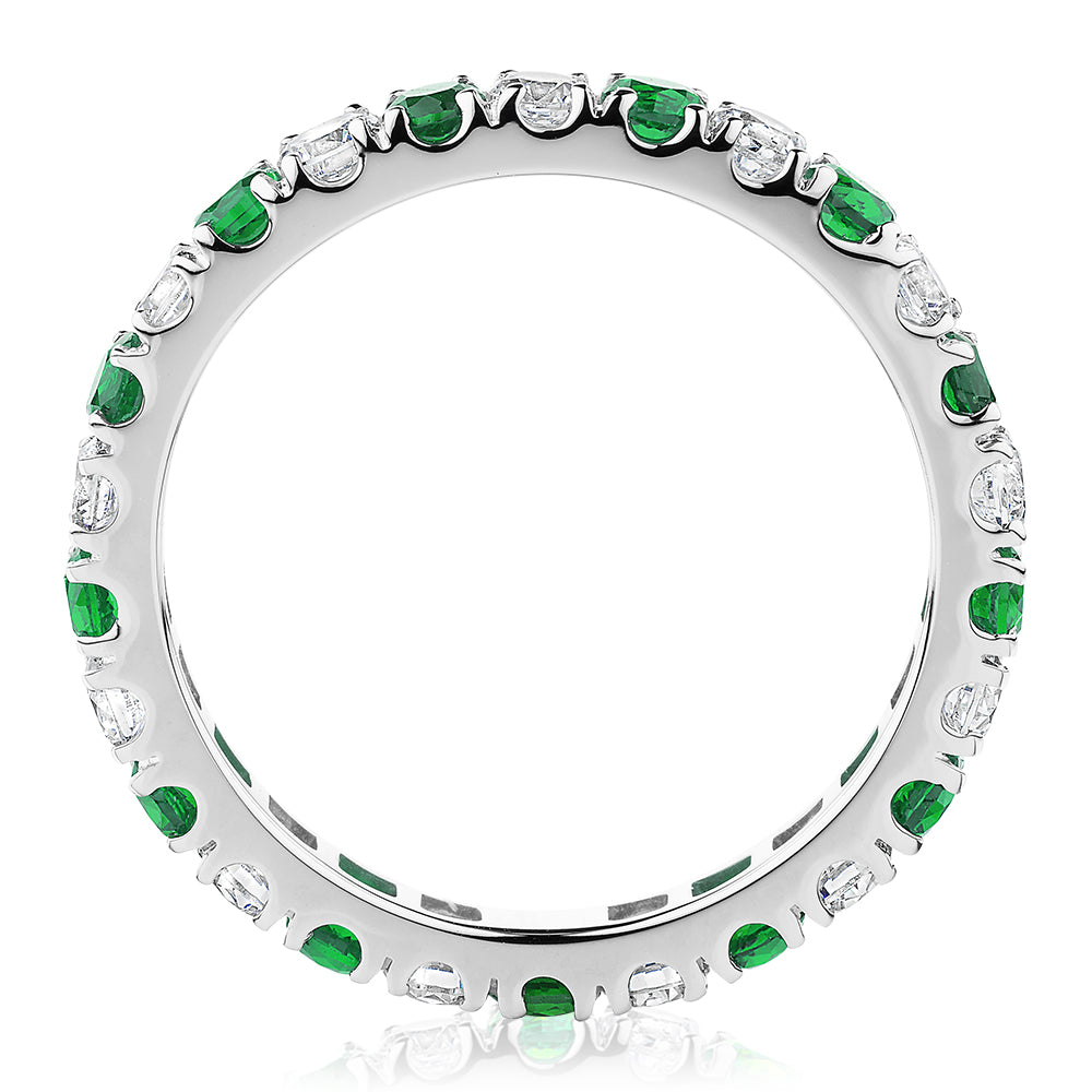 All-rounder eternity band with emerald simulants and 0.78 carats* of diamond simulants in 14 carat white gold