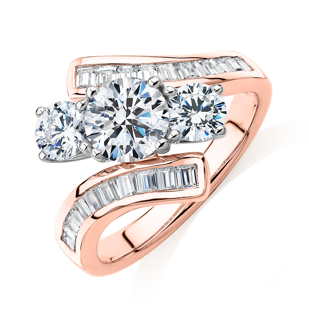 Three stone ring with 2.63 carats* of diamond simulants in 10 carat rose and white gold
