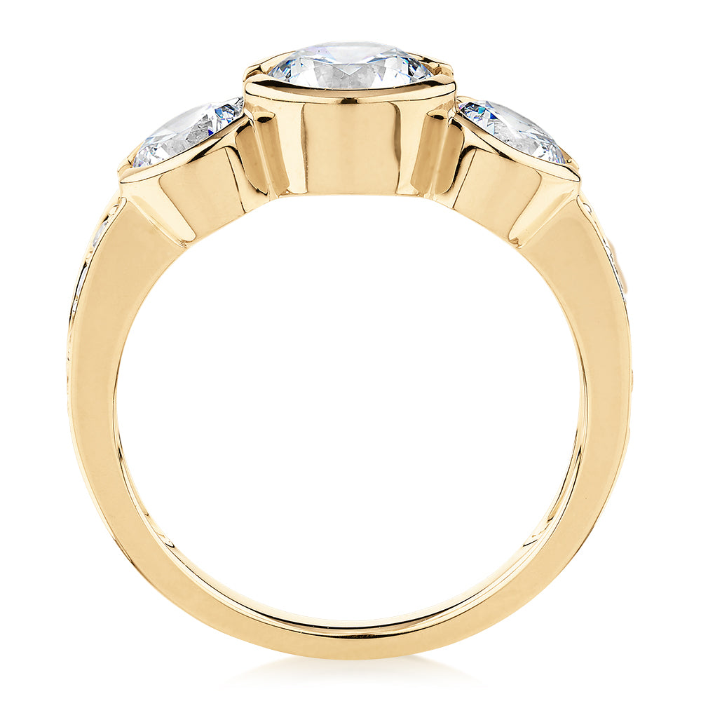 Three stone ring with 2.11 carats* of diamond simulants in 10 carat yellow gold