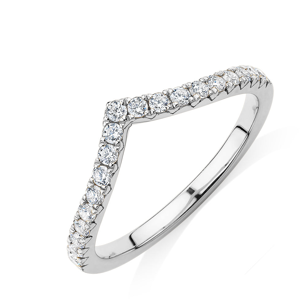 Round Brilliant curved wedding or eternity band with 0.57 carats* of diamond simulants in 10 carat white gold