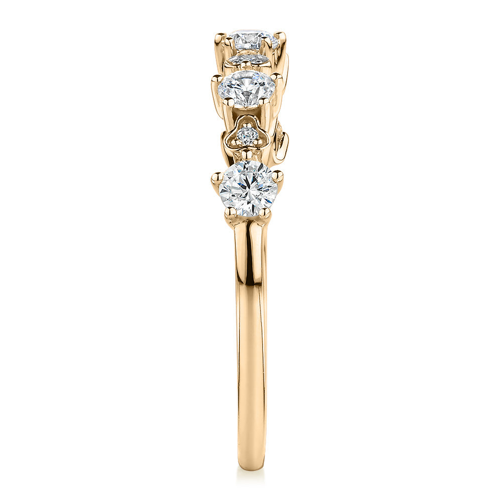 Wedding or eternity band with 0.32 carats* of diamond simulants in 10 carat yellow gold