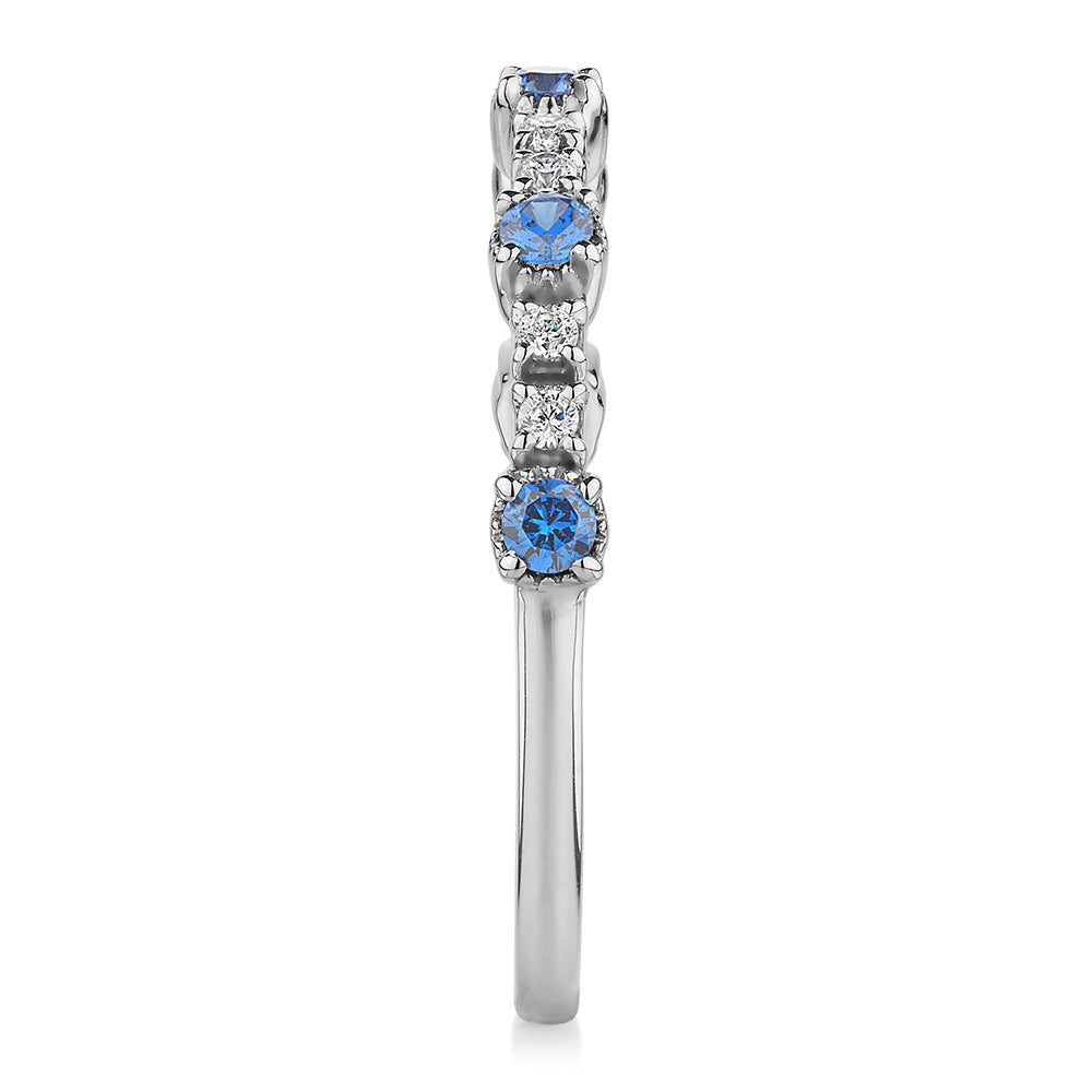 Wedding or eternity band with blue topaz and diamond simulants in 10 carat white gold