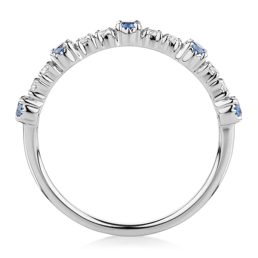 Wedding or eternity band with blue topaz and diamond simulants in 10 carat white gold