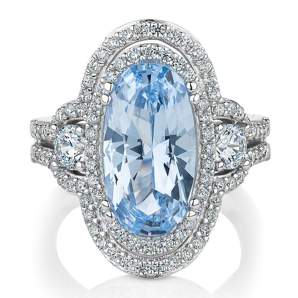 Dress ring with blue topaz simulant and 1.42 carats* of diamond simulants in sterling silver