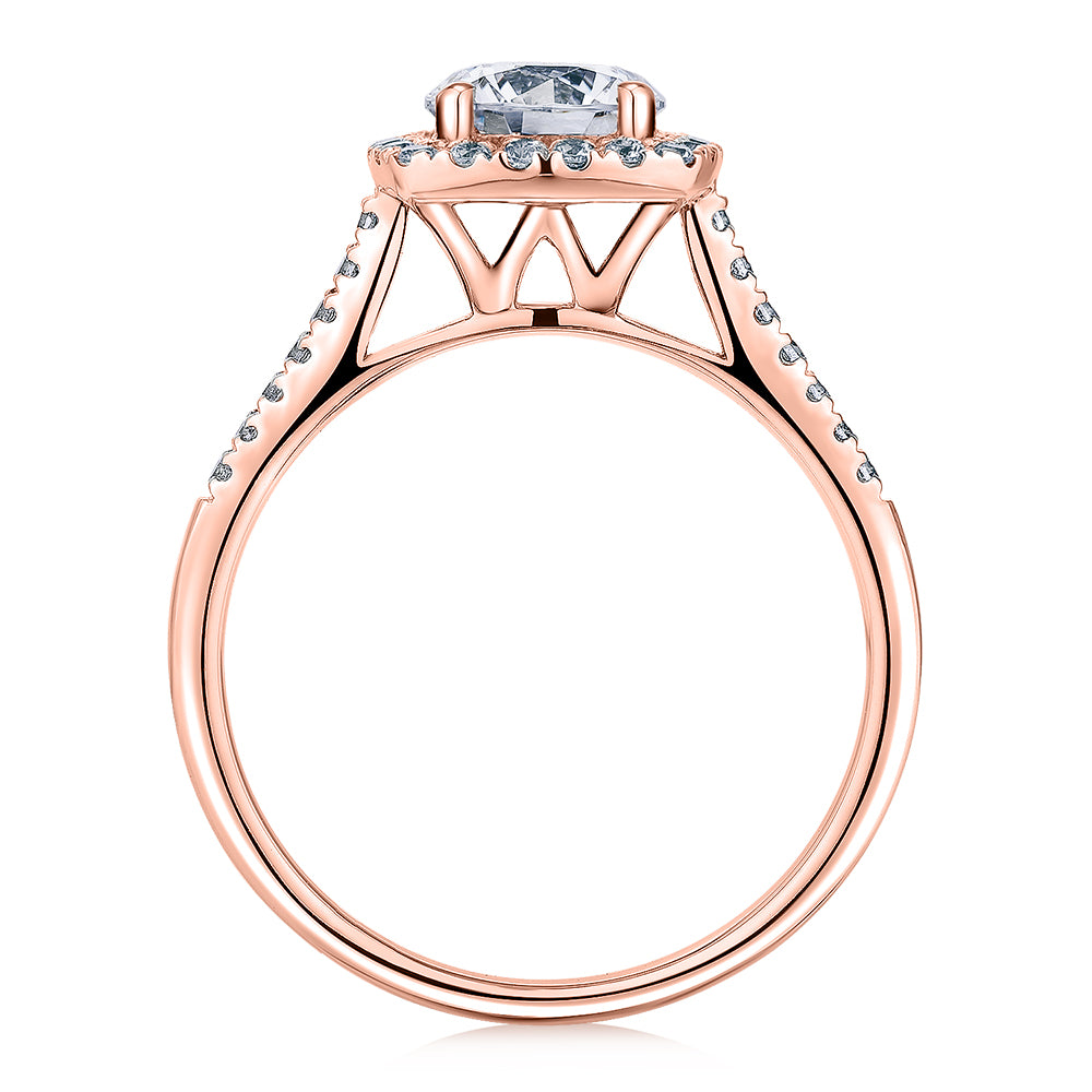Round Brilliant halo engagement ring with 1.26 carats* of diamond simulants in 14 carat rose gold