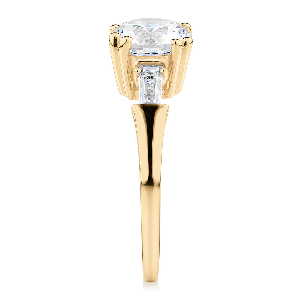 Round Brilliant and Baguette shouldered engagement ring with 2.46 carats* of diamond simulants in 10 carat yellow gold