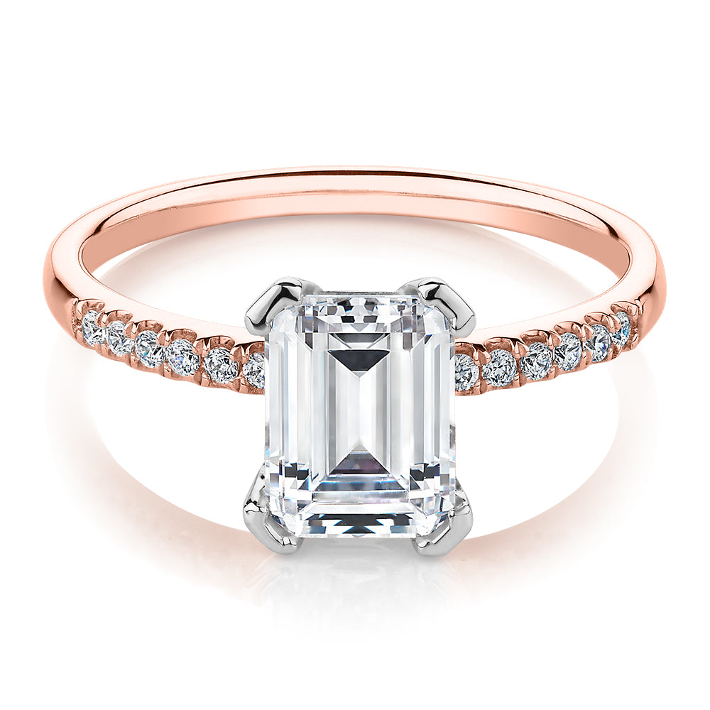 Emerald Cut and Round Brilliant shouldered engagement ring with 1.82 carats* of diamond simulants in 14 carat rose and white gold