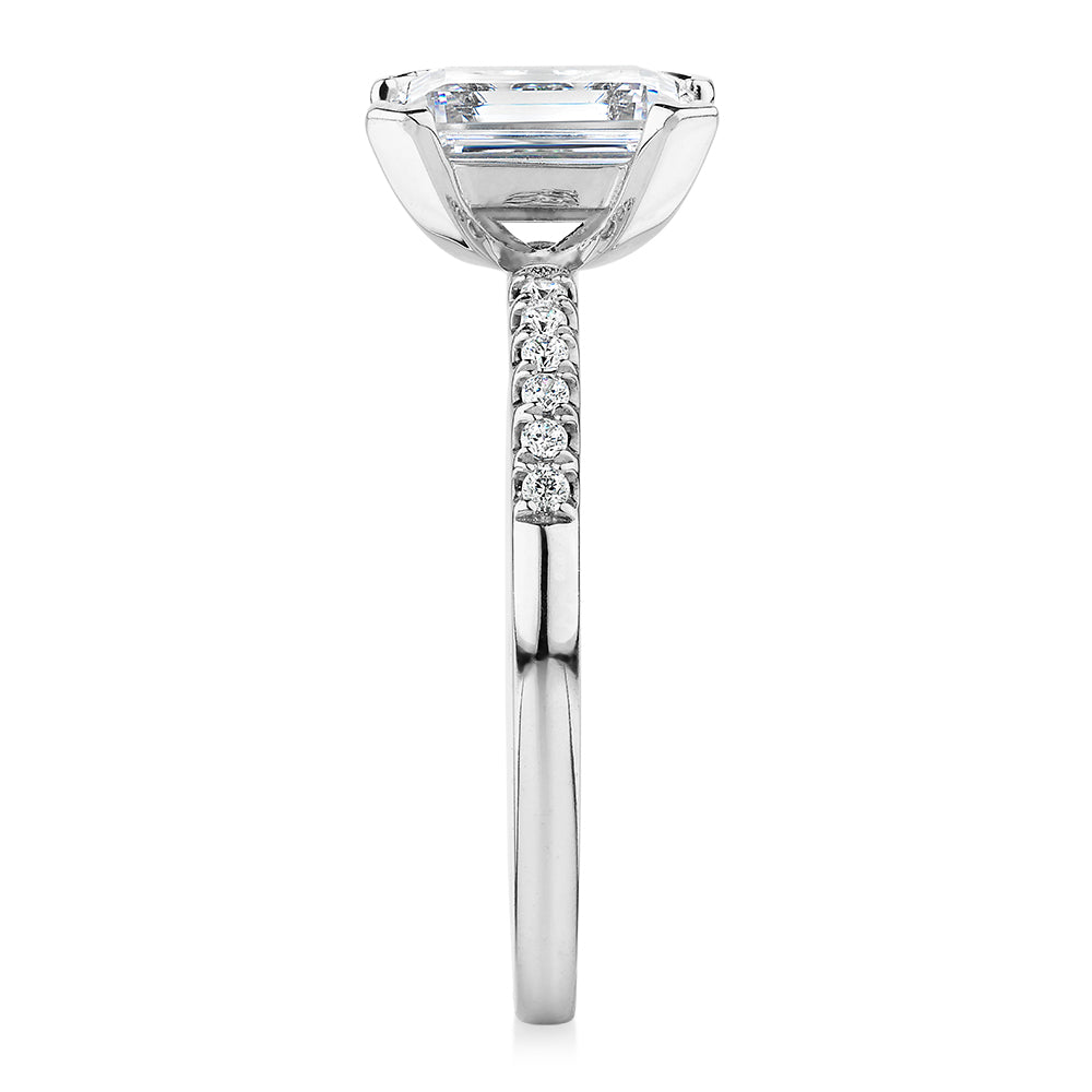 Emerald Cut and Round Brilliant shouldered engagement ring with 1.82 carats* of diamond simulants in 14 carat white gold