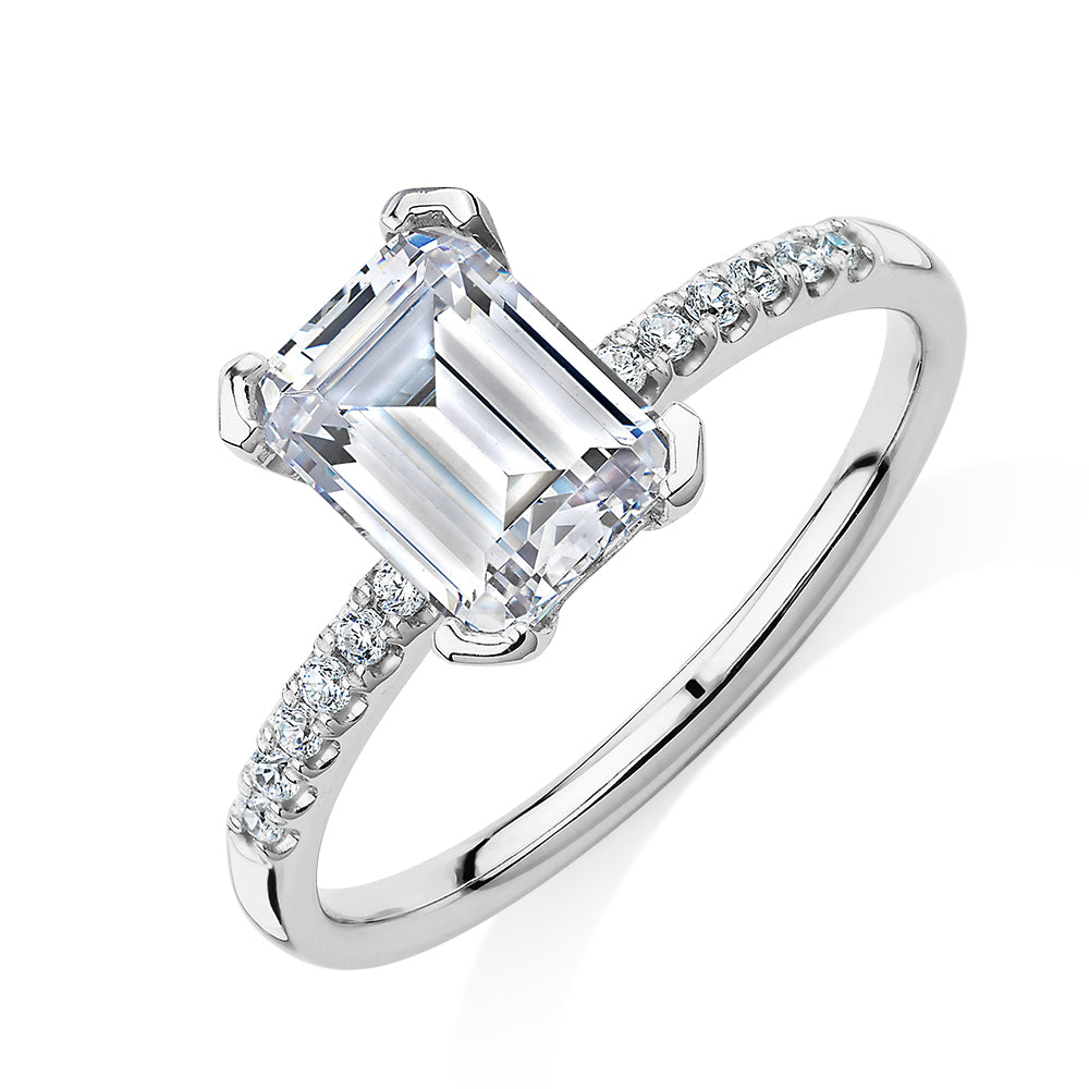 Emerald Cut and Round Brilliant shouldered engagement ring with 1.82 carats* of diamond simulants in 14 carat white gold