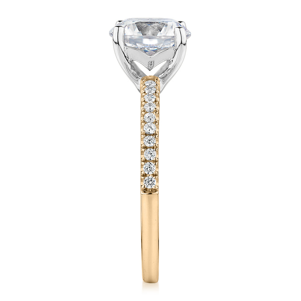 Round Brilliant shouldered engagement ring with 2.17 carats* of diamond simulants in 14 carat yellow and white gold