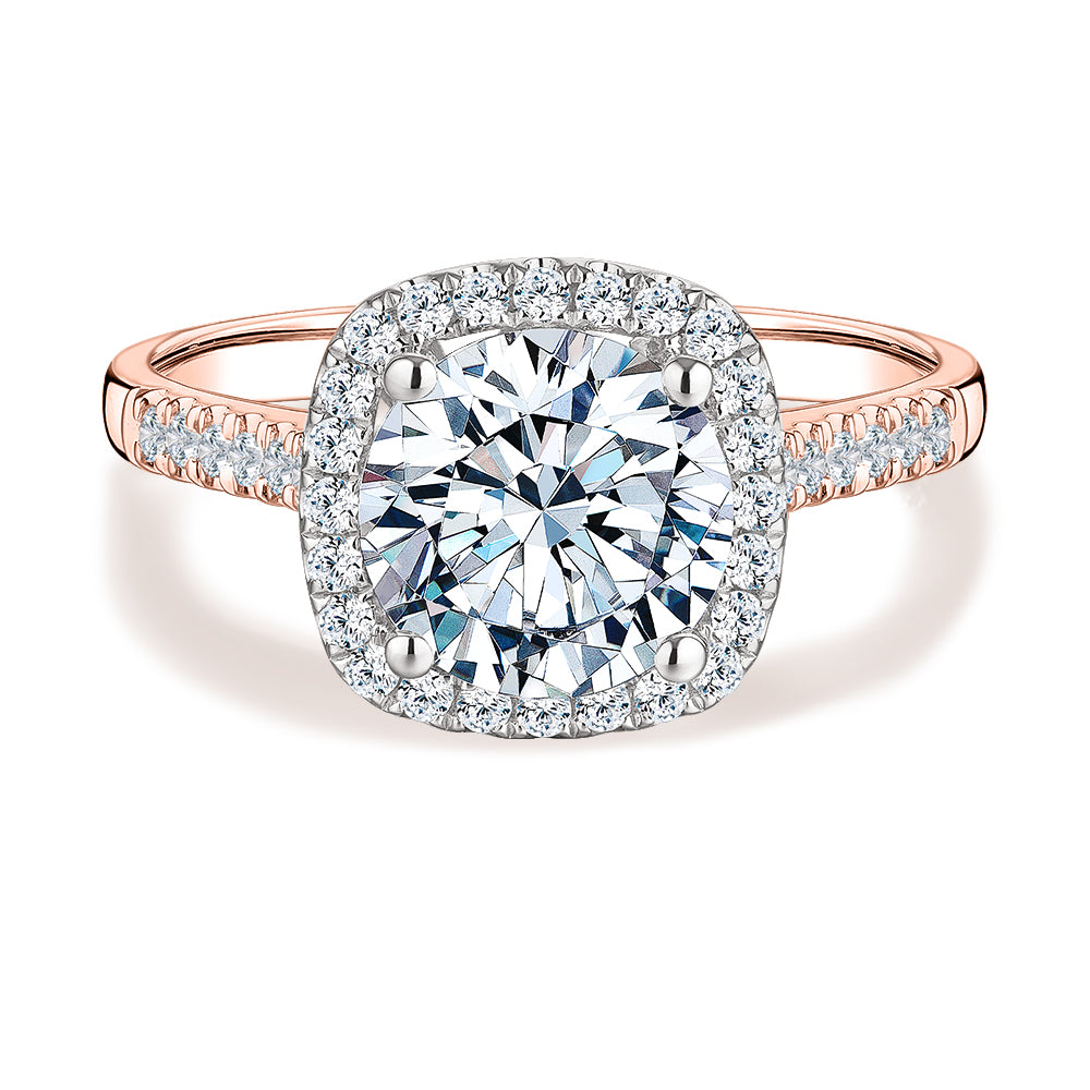 Round Brilliant halo engagement ring with 2.42 carats* of diamond simulants in 14 carat rose and white gold