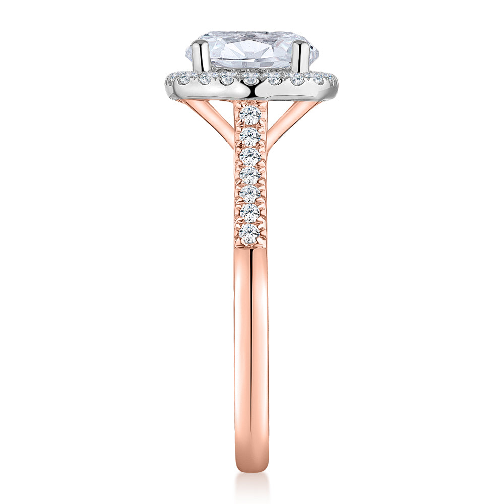Round Brilliant halo engagement ring with 2.42 carats* of diamond simulants in 14 carat rose and white gold