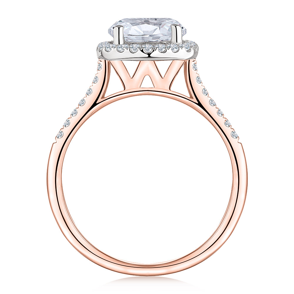 Round Brilliant halo engagement ring with 2.42 carats* of diamond simulants in 14 carat rose and white gold