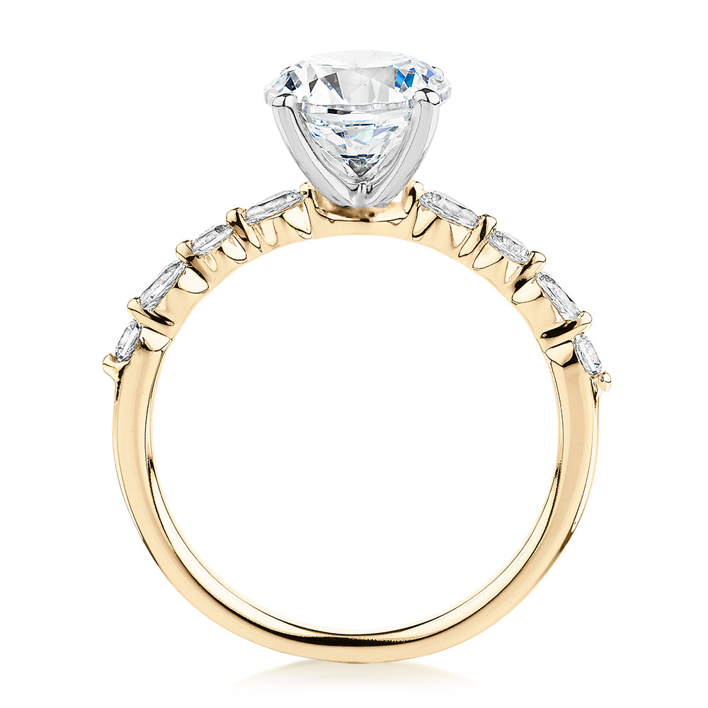 Round Brilliant and Pear shouldered engagement ring with 2.68 carats* of diamond simulants in 14 carat yellow and white gold