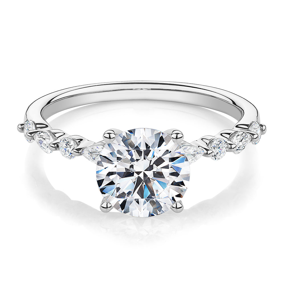 Round Brilliant and Pear shouldered engagement ring with 2.68 carats* of diamond simulants in 14 carat white gold