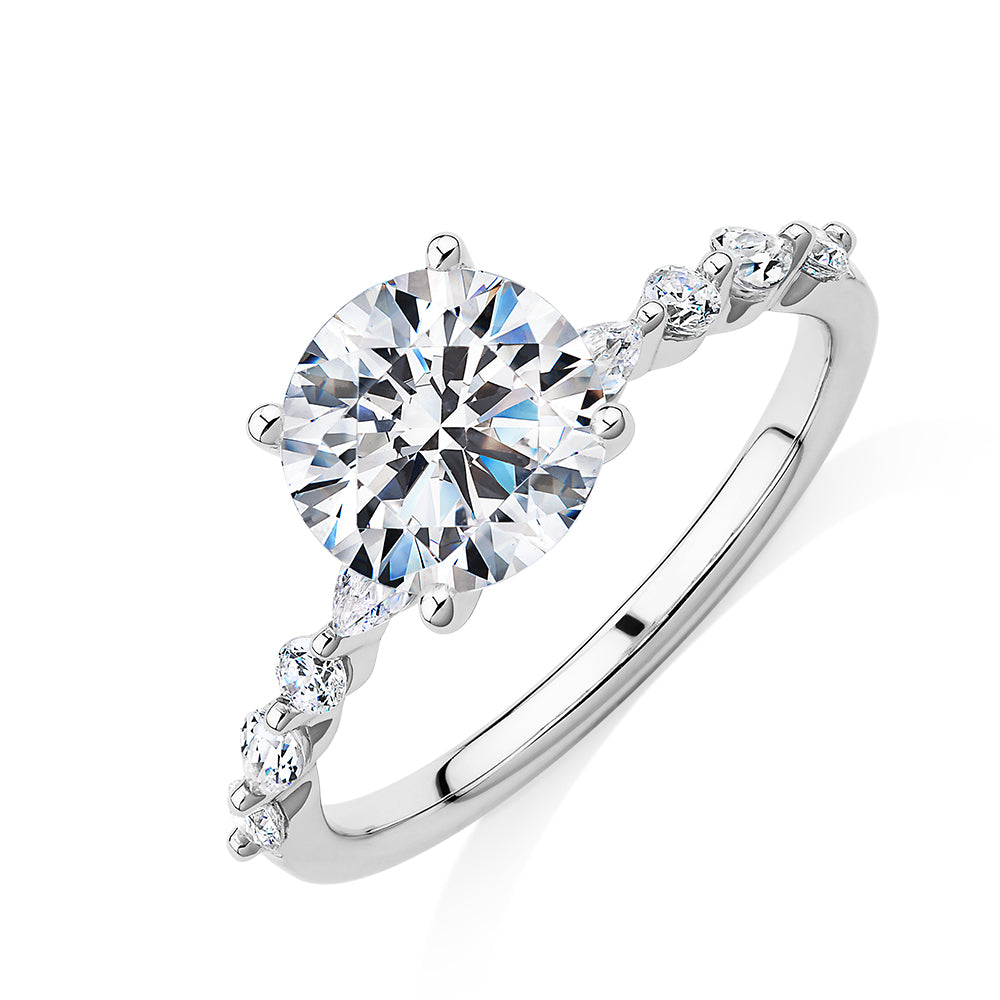 Round Brilliant and Pear shouldered engagement ring with 2.68 carats* of diamond simulants in 14 carat white gold
