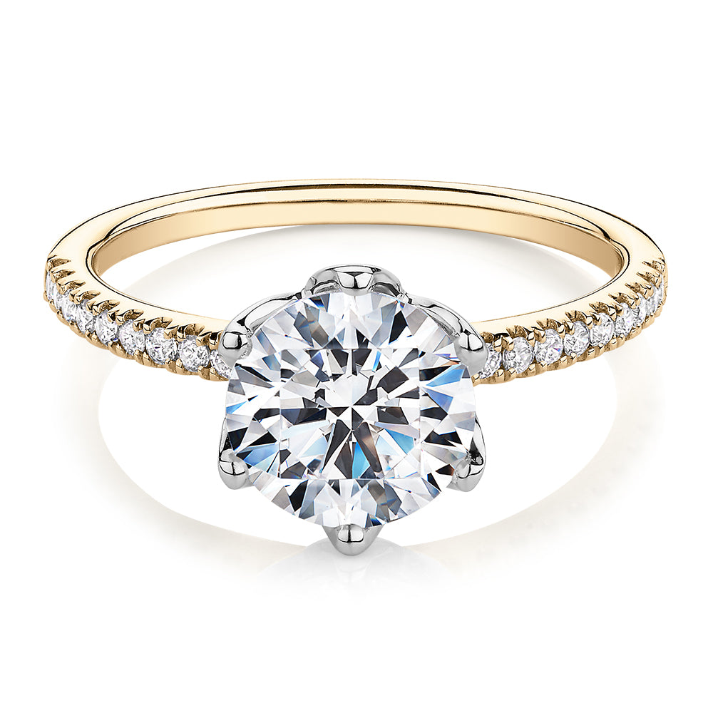 Round Brilliant shouldered engagement ring with 2.24 carats* of diamond simulants in 14 carat yellow and white gold