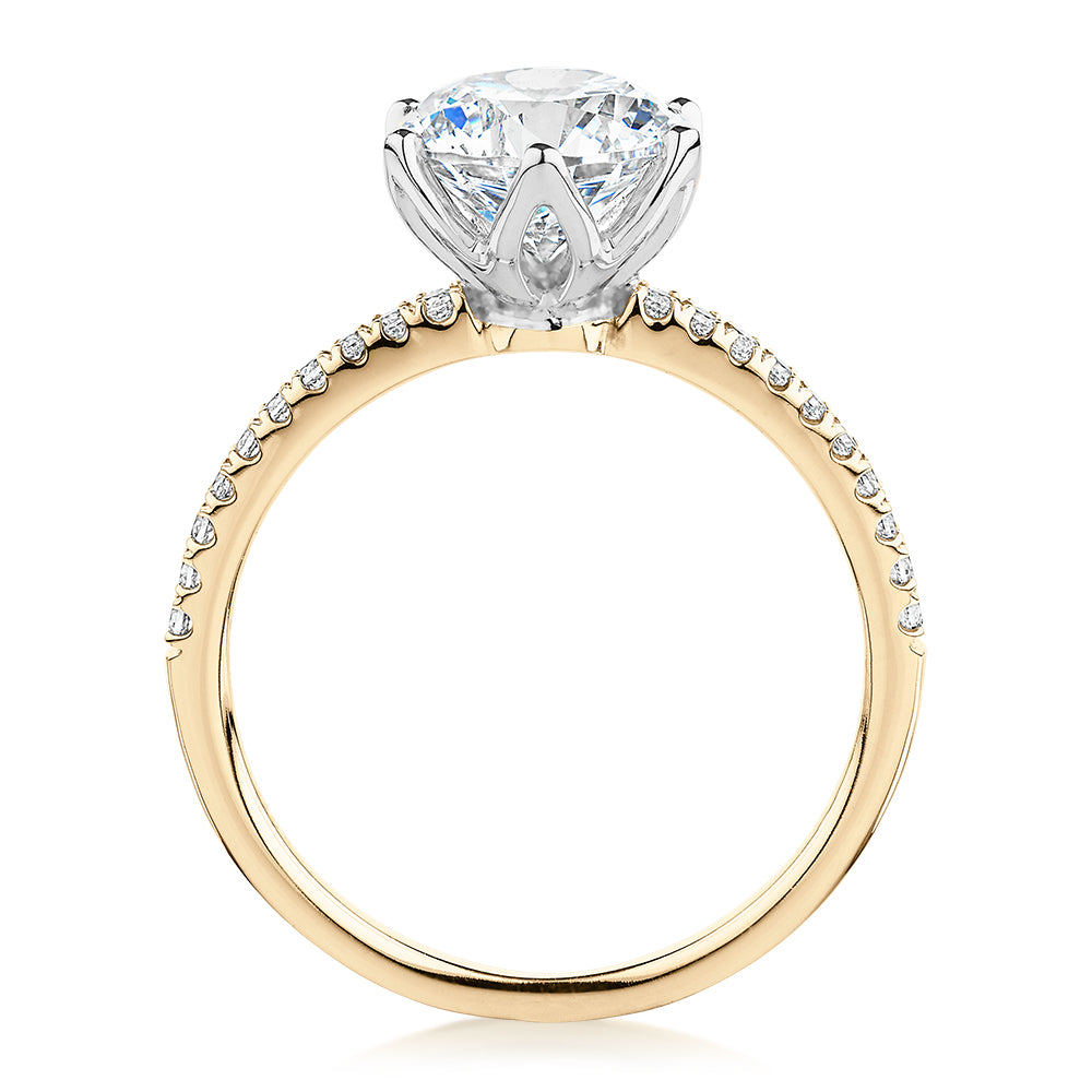 Round Brilliant shouldered engagement ring with 2.24 carats* of diamond simulants in 14 carat yellow and white gold