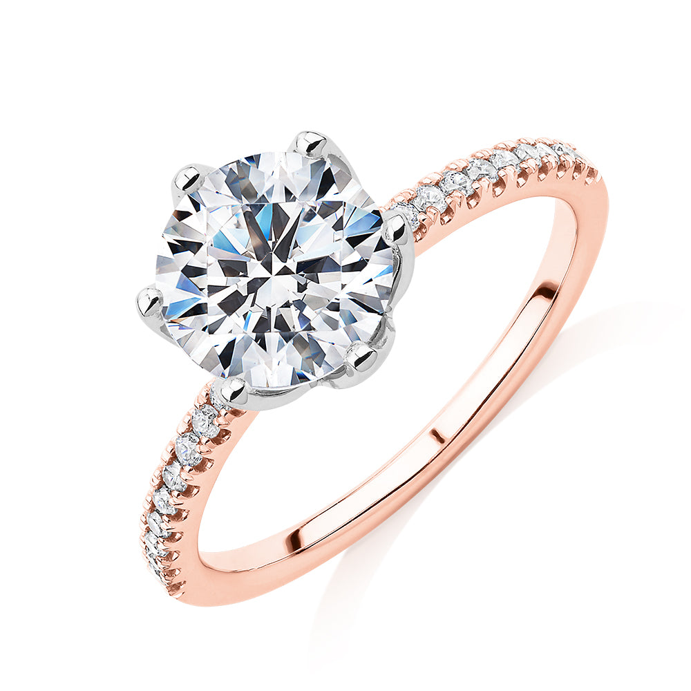 Round Brilliant shouldered engagement ring with 2.24 carats* of diamond simulants in 14 carat rose and white gold