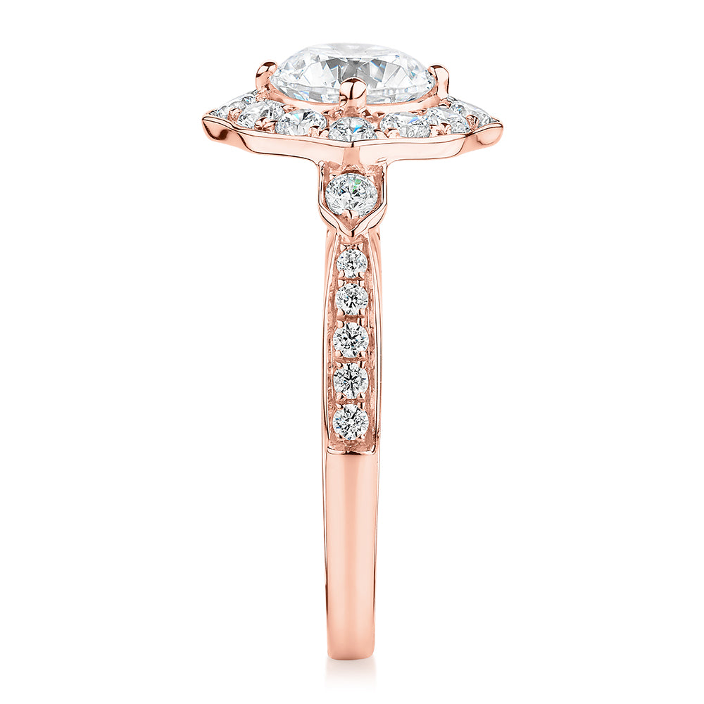 Round Brilliant halo engagement ring with 1.54 carats* of diamond simulants in 10 carat rose gold