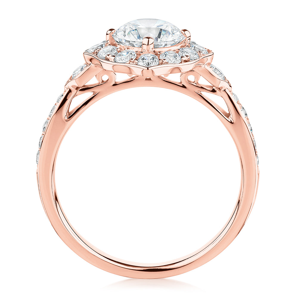 Round Brilliant halo engagement ring with 1.54 carats* of diamond simulants in 10 carat rose gold