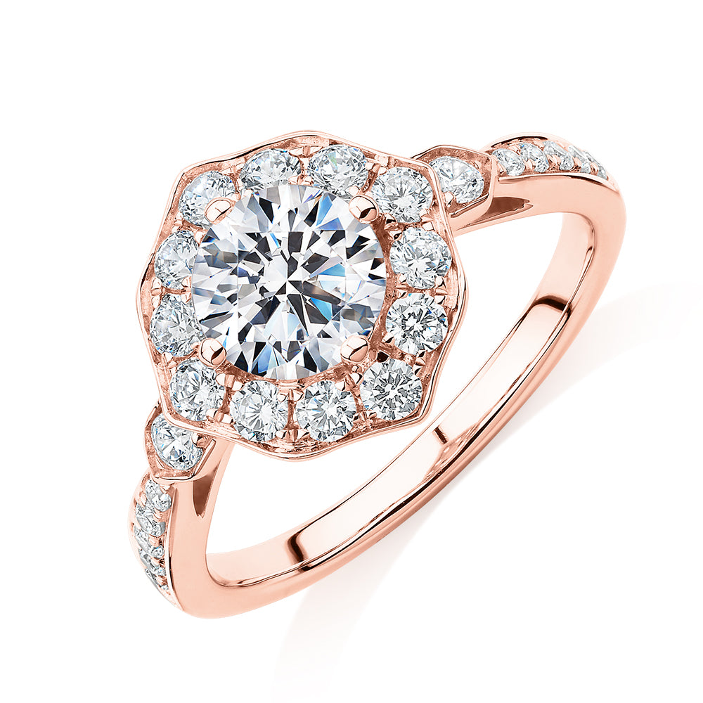 Round Brilliant halo engagement ring with 1.54 carats* of diamond simulants in 10 carat rose gold