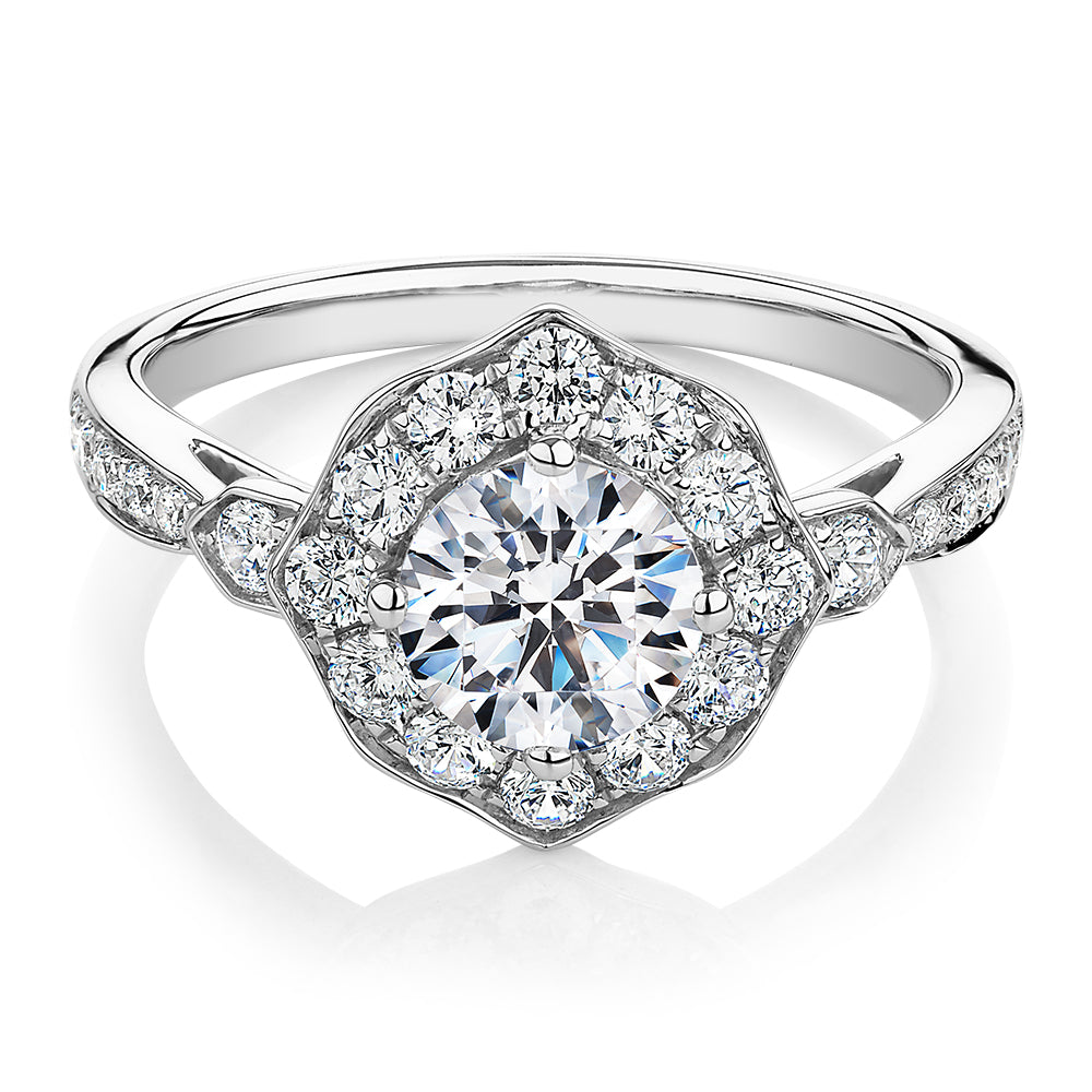 Round Brilliant halo engagement ring with 1.54 carats* of diamond simulants in 10 carat white gold