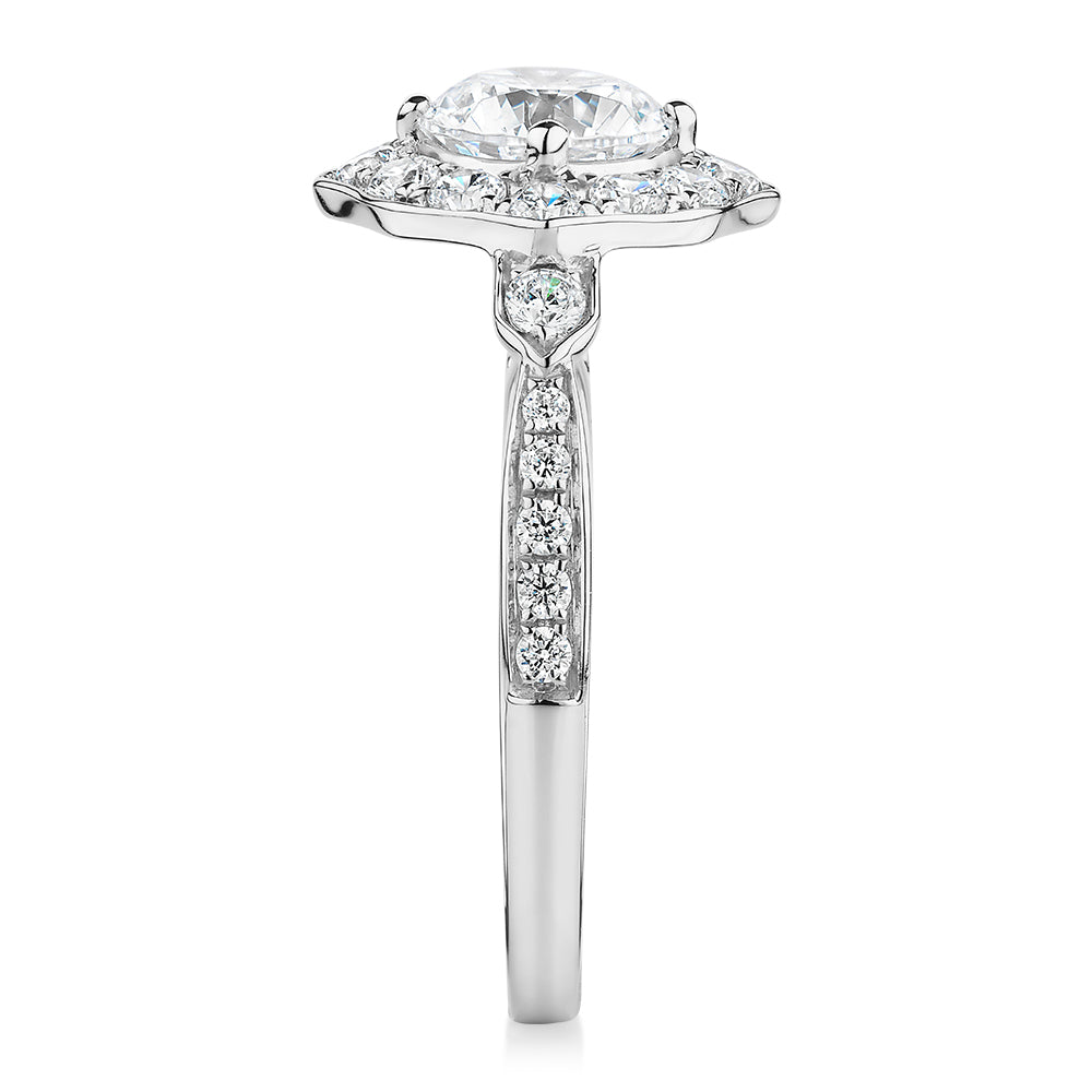 Round Brilliant halo engagement ring with 1.54 carats* of diamond simulants in 10 carat white gold
