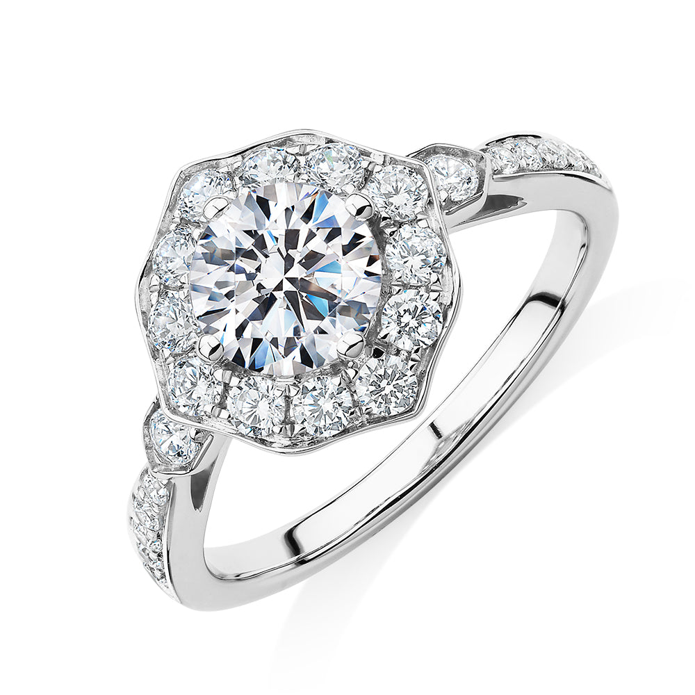 Round Brilliant halo engagement ring with 1.54 carats* of diamond simulants in 10 carat white gold