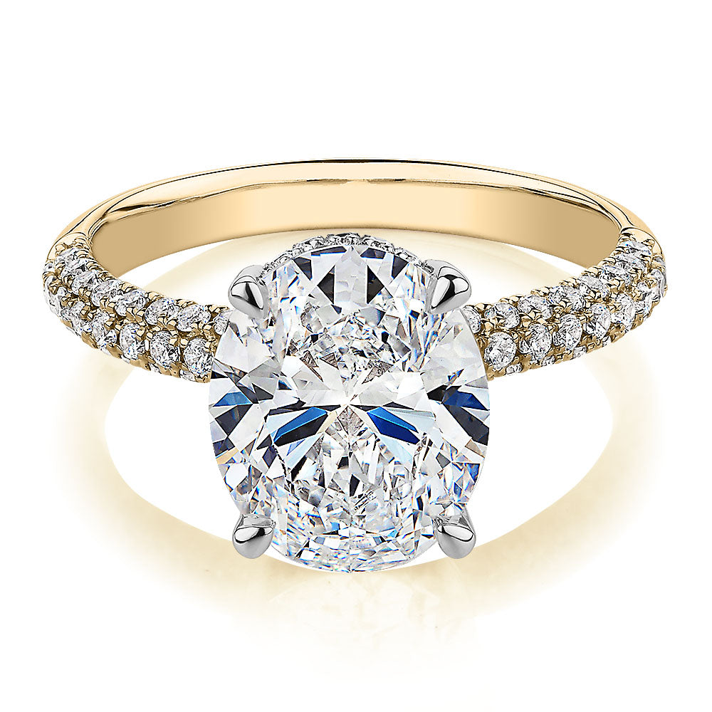 Oval and Round Brilliant shouldered engagement ring with 4.35 carats* of diamond simulants in 10 carat yellow and white gold