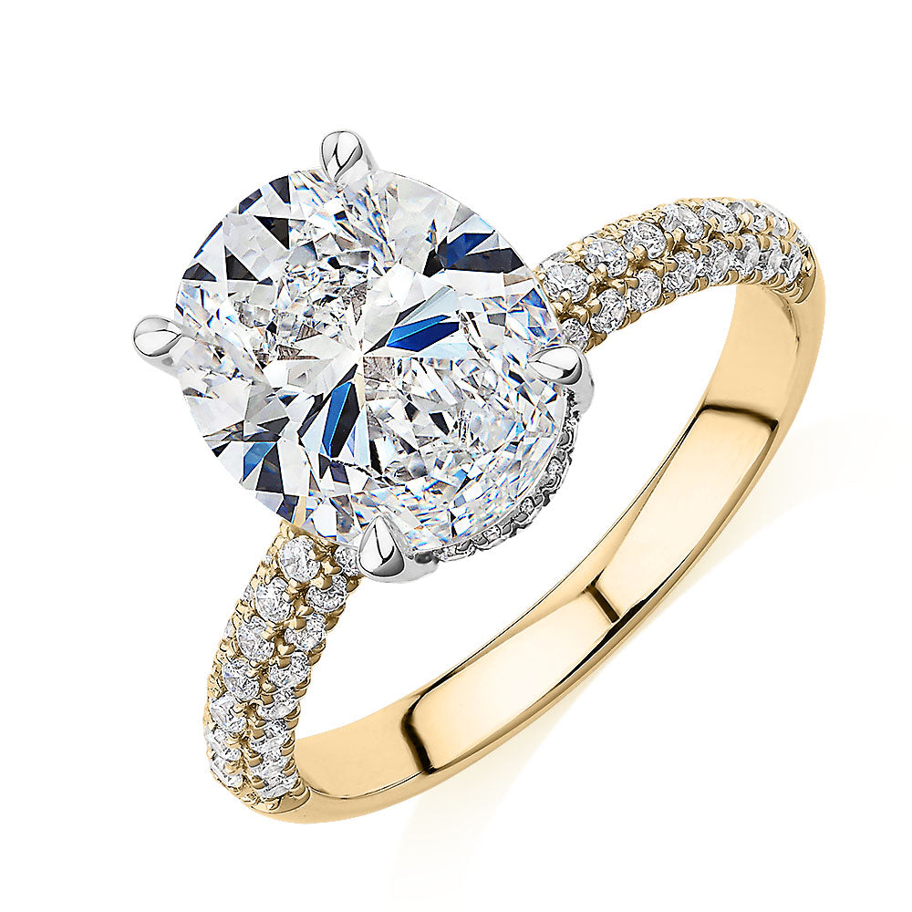 Oval and Round Brilliant shouldered engagement ring with 4.35 carats* of diamond simulants in 10 carat yellow and white gold