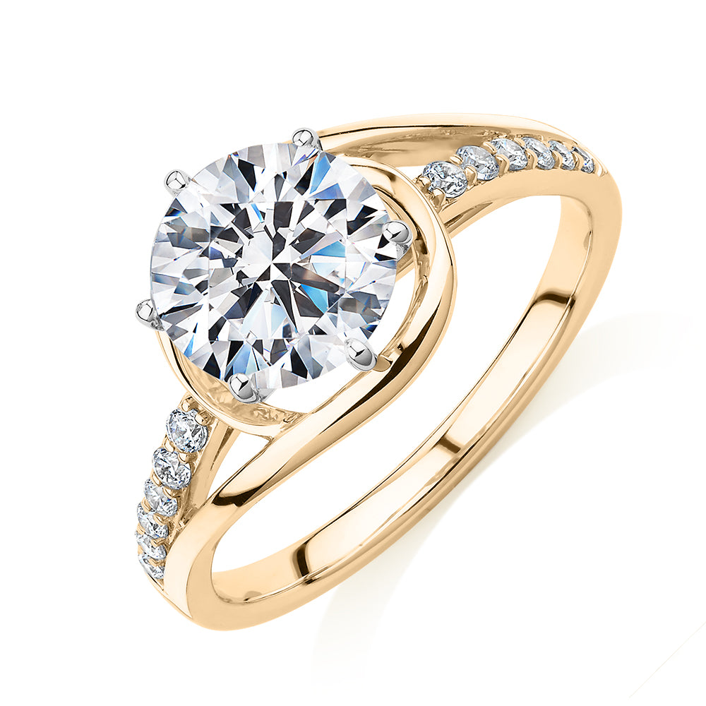 Round Brilliant shouldered engagement ring with 2.18 carats* of diamond simulants in 14 carat yellow and white gold