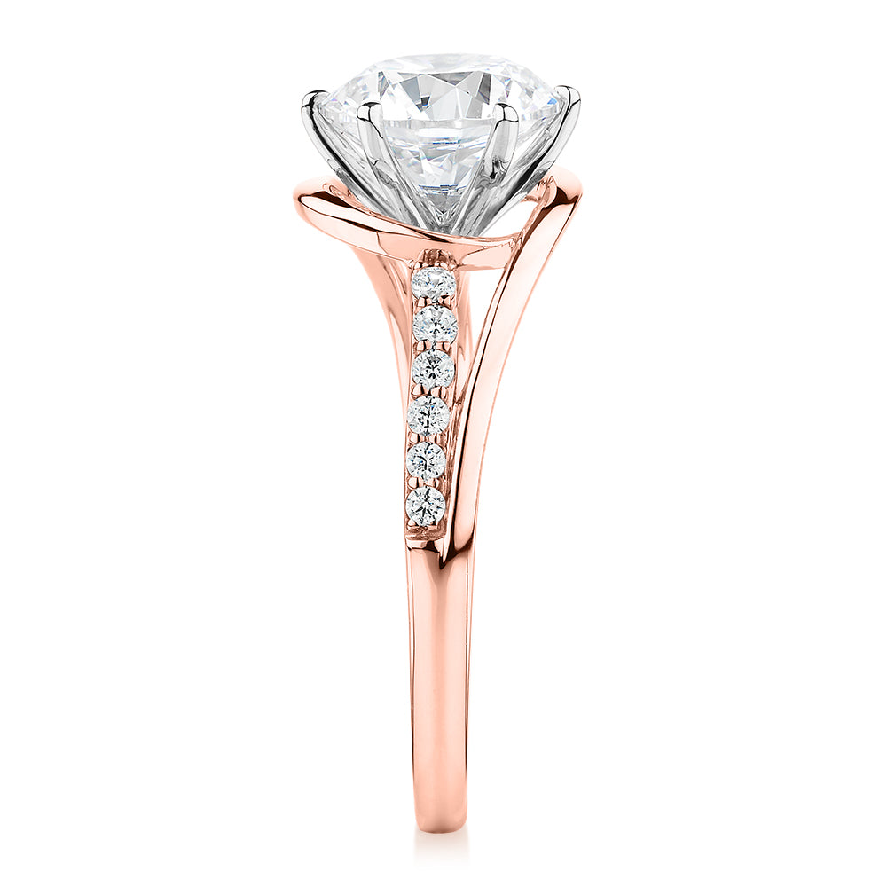 Round Brilliant shouldered engagement ring with 2.18 carats* of diamond simulants in 14 carat rose and white gold