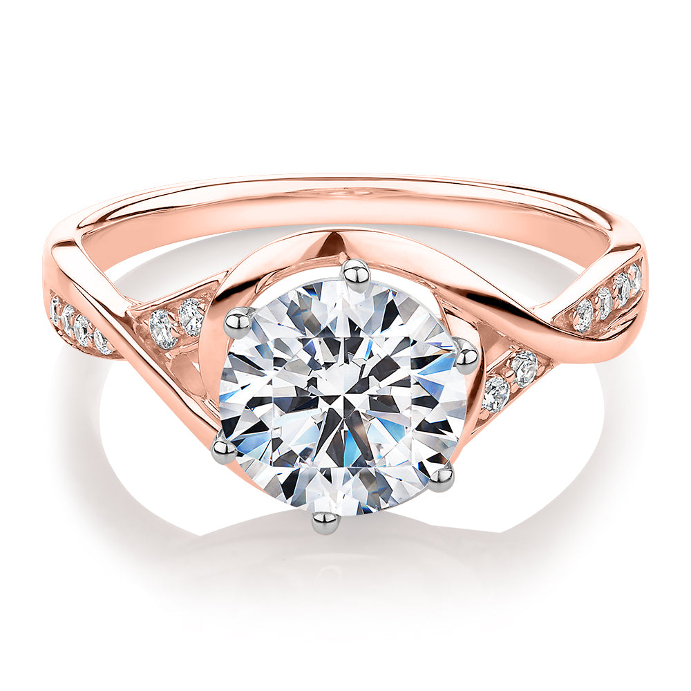 Round Brilliant shouldered engagement ring with 2.13 carats* of diamond simulants in 14 carat rose and white gold