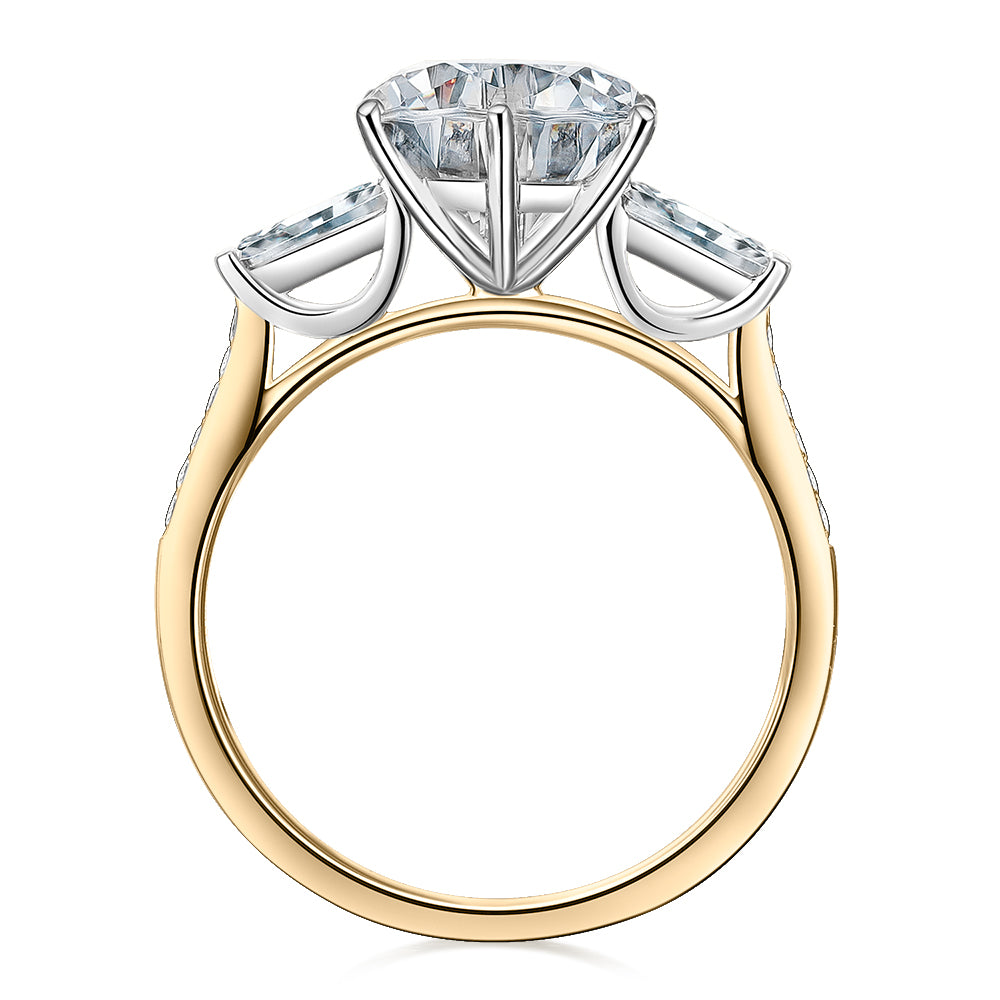 Round Brilliant and Baguette shouldered engagement ring with 3.23 carats* of diamond simulants in 14 carat yellow and white gold