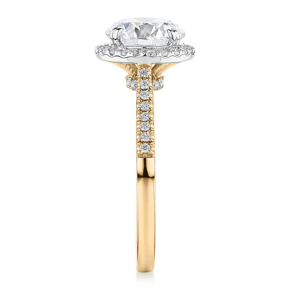Round Brilliant halo engagement ring with 2.27 carats* of diamond simulants in 14 carat yellow and white gold