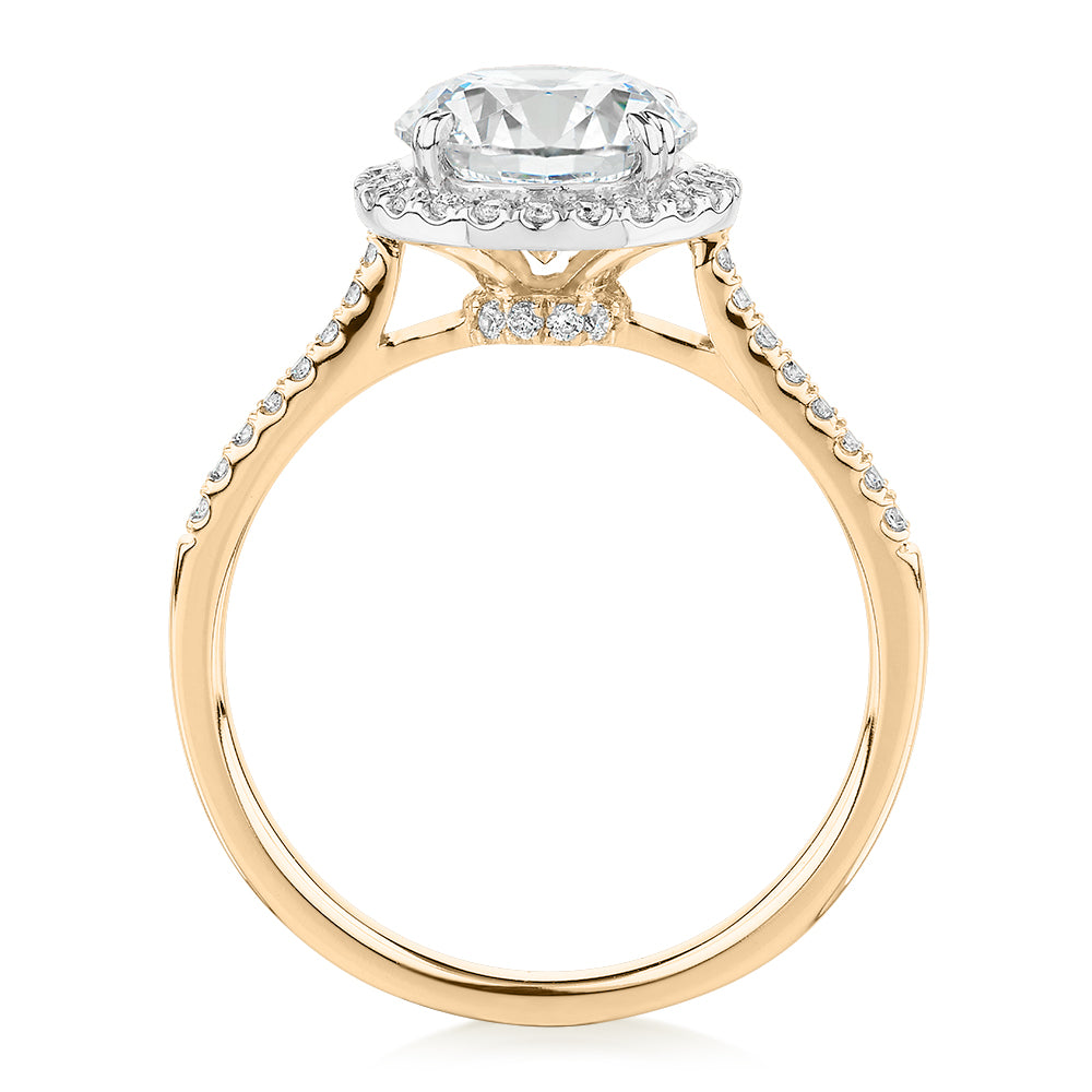 Round Brilliant halo engagement ring with 2.27 carats* of diamond simulants in 14 carat yellow and white gold