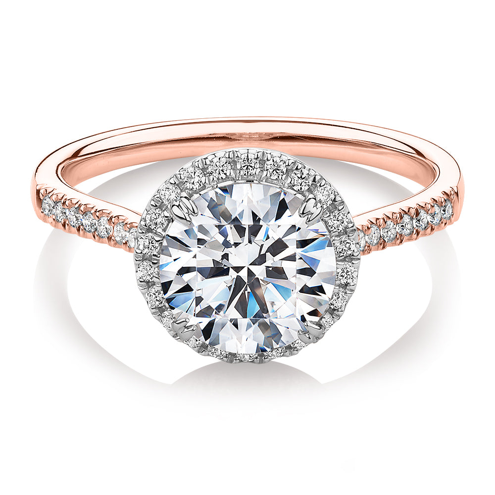 Round Brilliant halo engagement ring with 2.27 carats* of diamond simulants in 14 carat rose and white gold