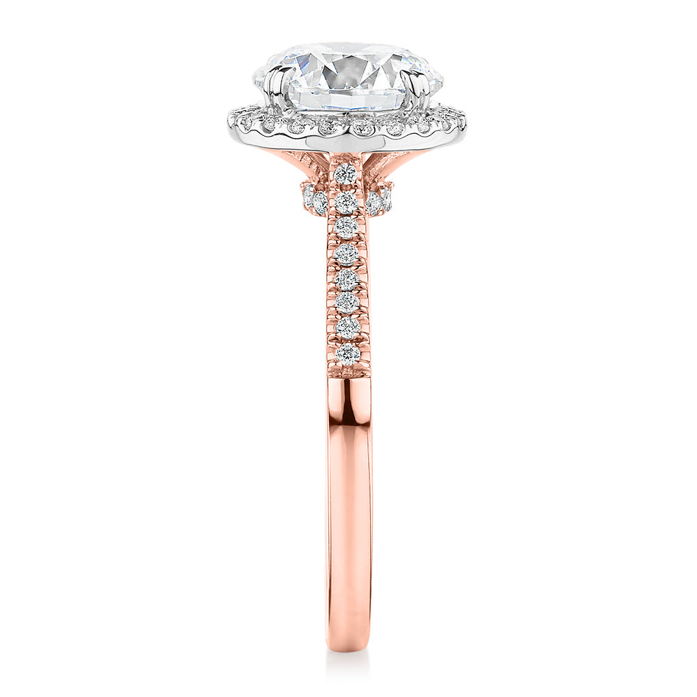 Round Brilliant halo engagement ring with 2.27 carats* of diamond simulants in 14 carat rose and white gold
