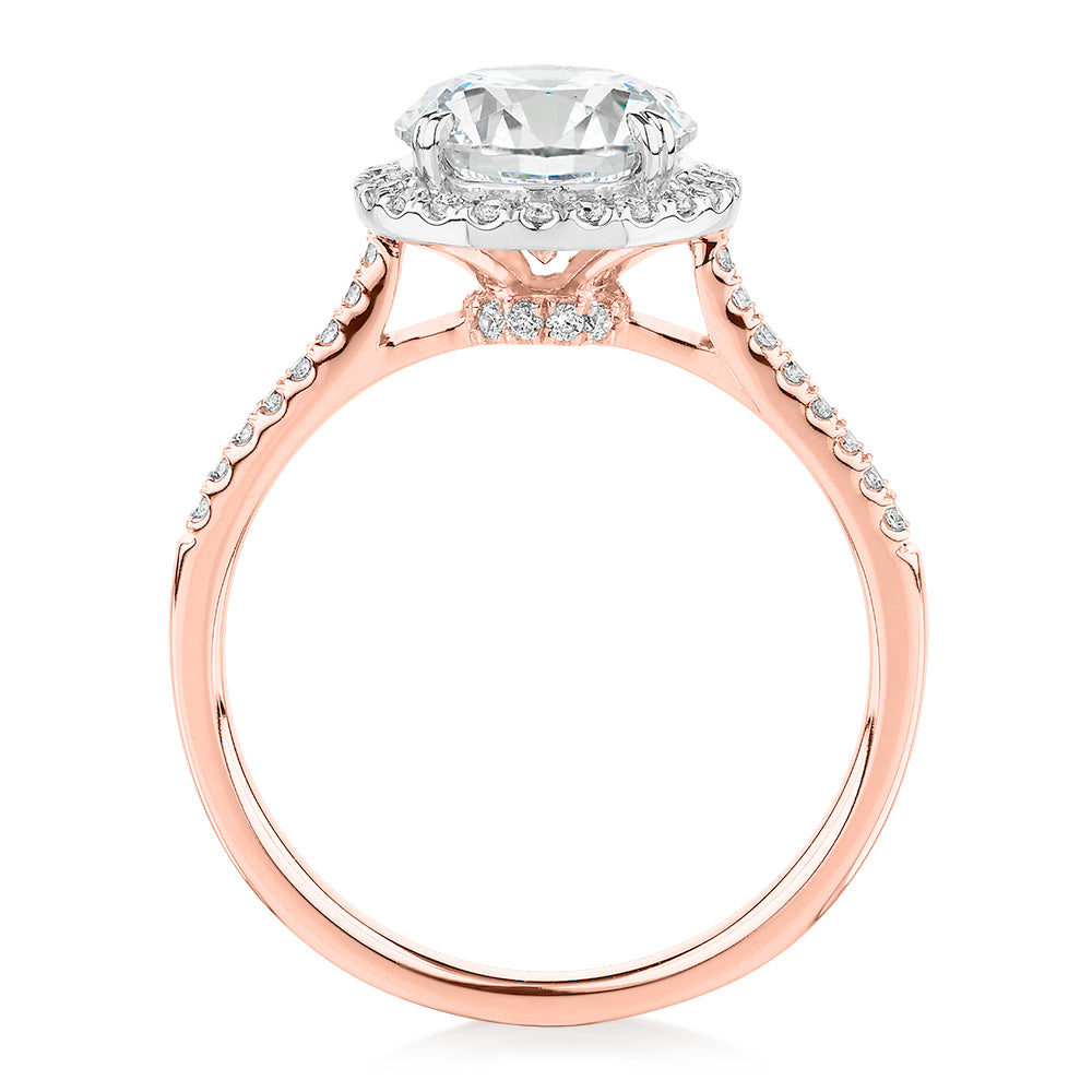 Round Brilliant halo engagement ring with 2.27 carats* of diamond simulants in 14 carat rose and white gold