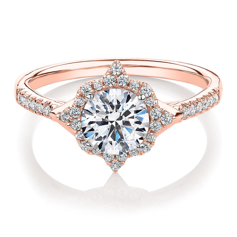 Round Brilliant halo engagement ring with 1.19 carats* of diamond simulants in 14 carat rose and white gold