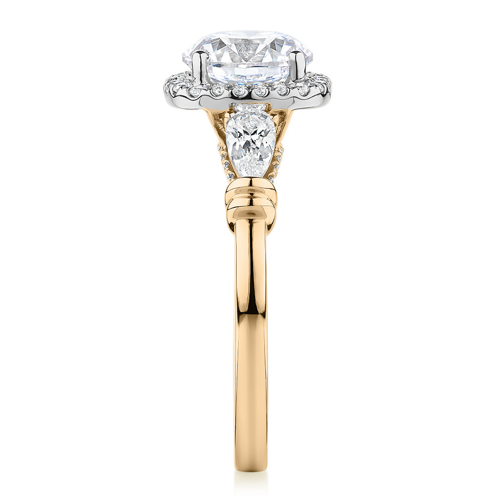 Round Brilliant halo engagement ring with 2.78 carats* of diamond simulants in 14 carat yellow and white gold